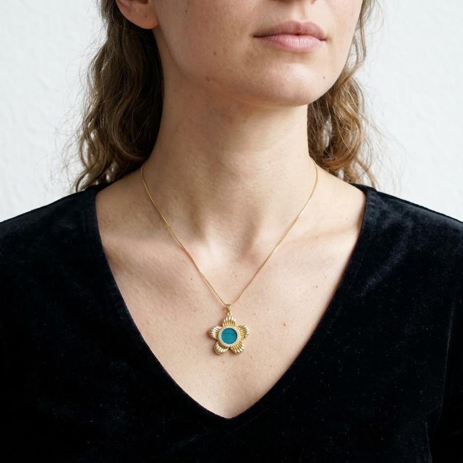 Spinning Flower Necklace With Peacock Feather