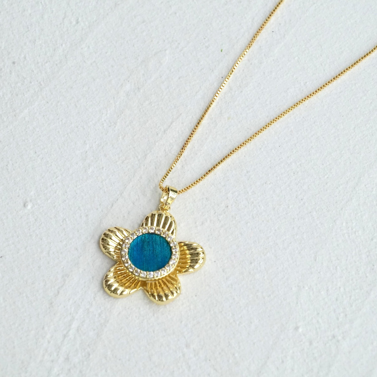Spinning Flower Necklace With Peacock Feather